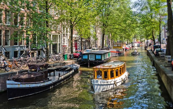 small boat in Amsterdam canal